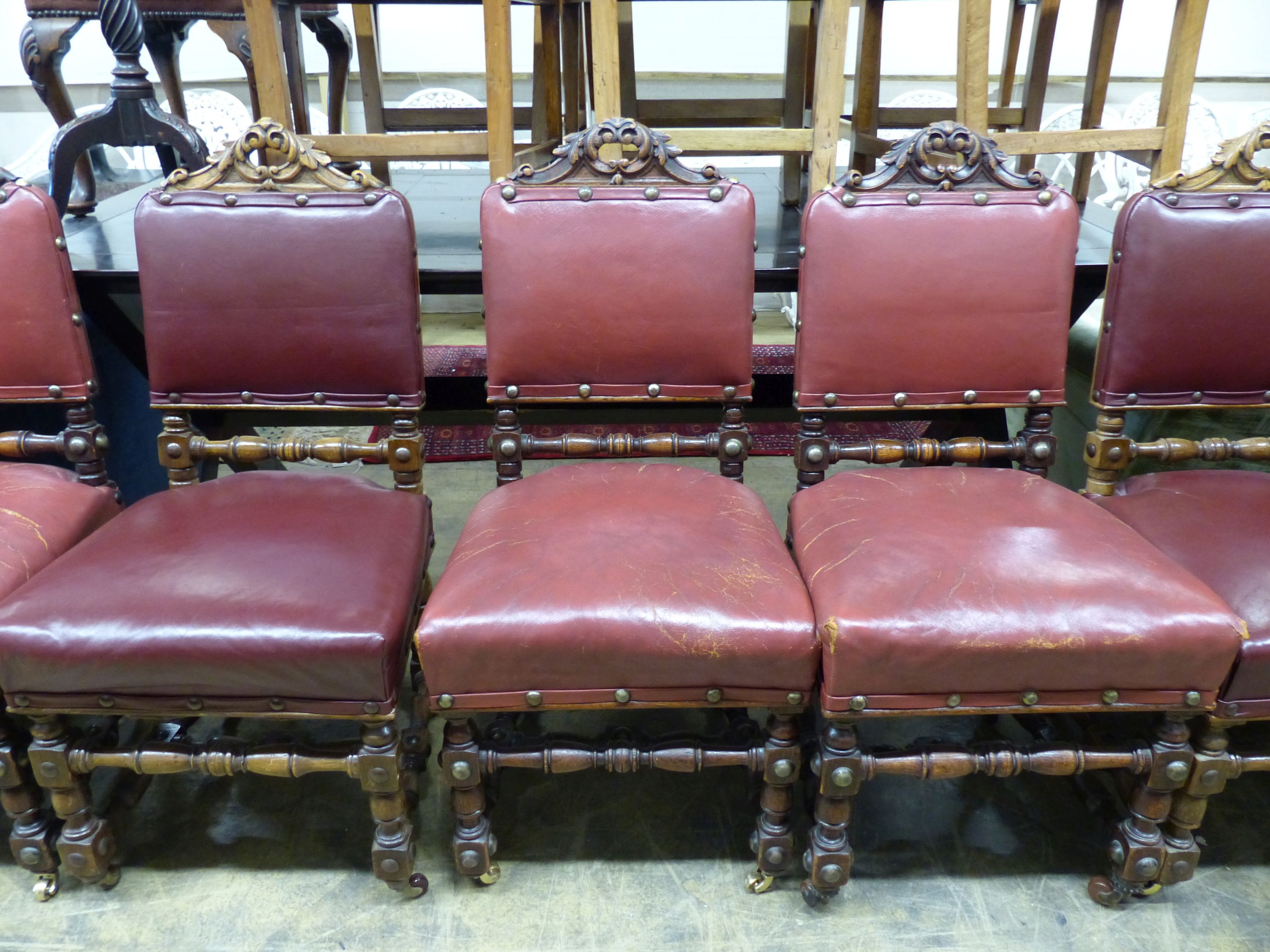 A set of ten Victorian 17th century style oak dining chairs